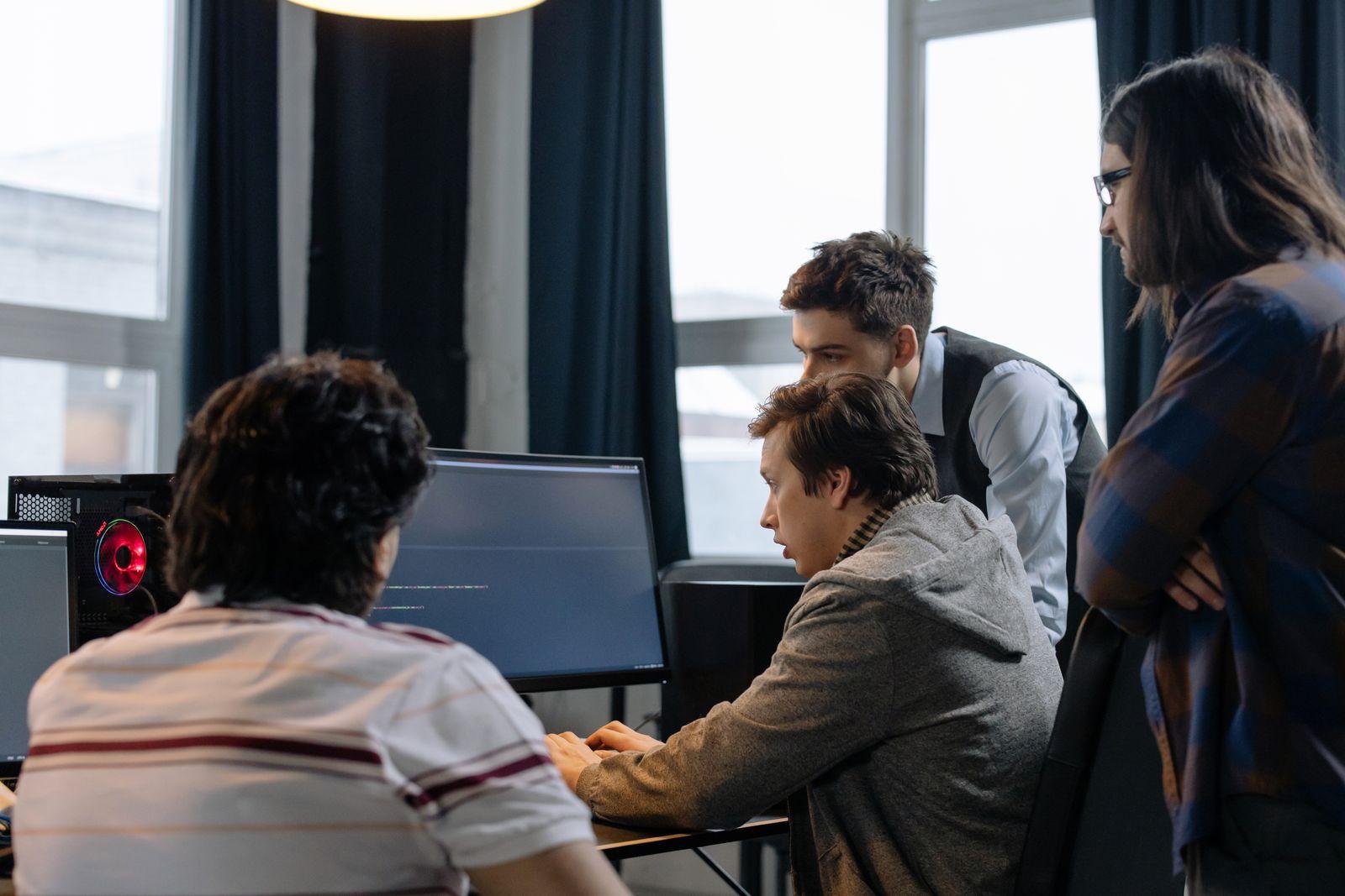 Project team collaborating on localization work across multiple screens